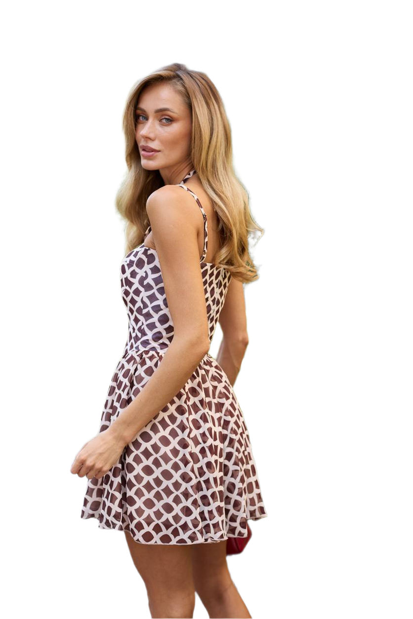 Woman wearing a patterned dress on a white background