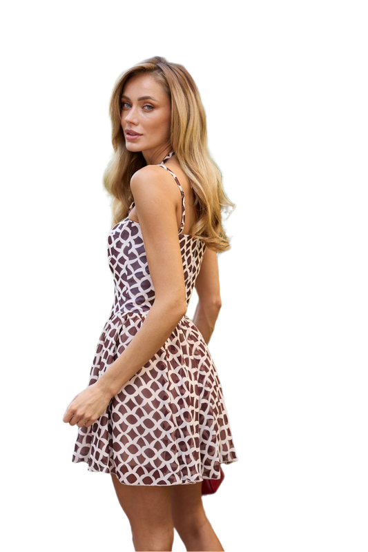 Woman wearing a patterned dress on a white background