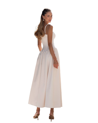 Woman wearing a white dress on a white background