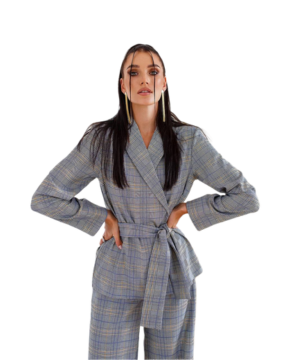 Woman wearing a blue checkered coat and pants on a white background