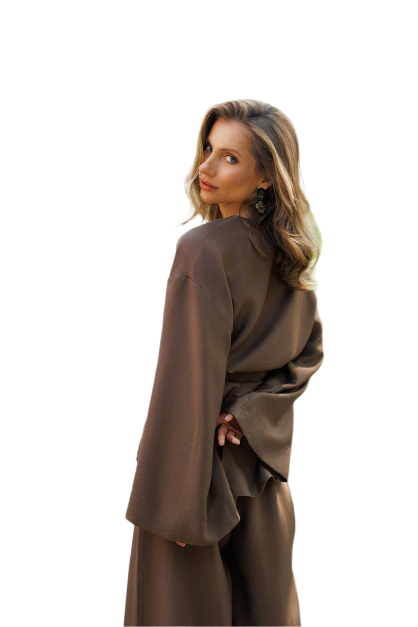 Woman wearing a brown outfit on a white background