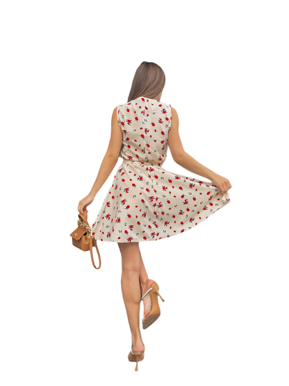 Woman in a floral dress posing on a white background