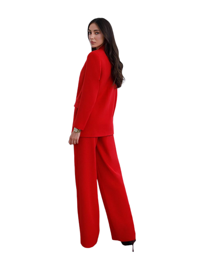 Woman wearing a red suit on a white background