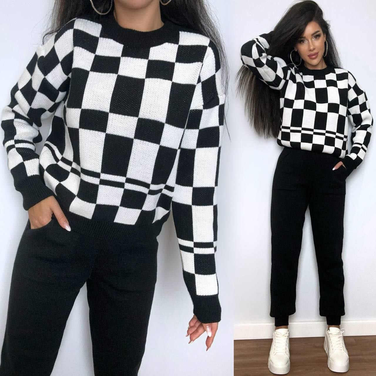 Two people wearing black and white checkered sweaters with a plain background