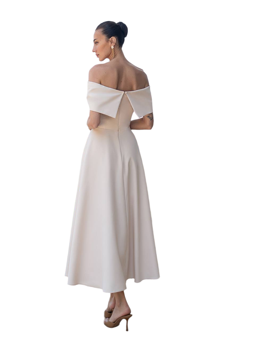 Woman wearing a white off-shoulder dress on a white background