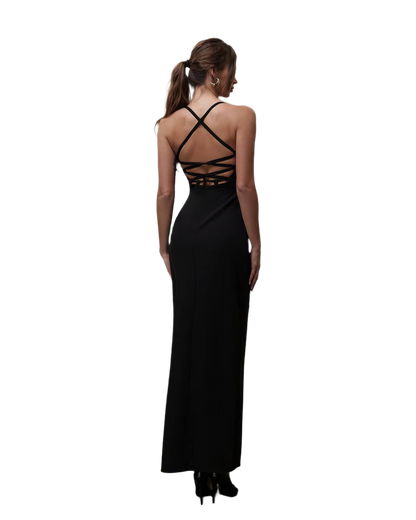 Black evening gown with criss-cross back design on a white background