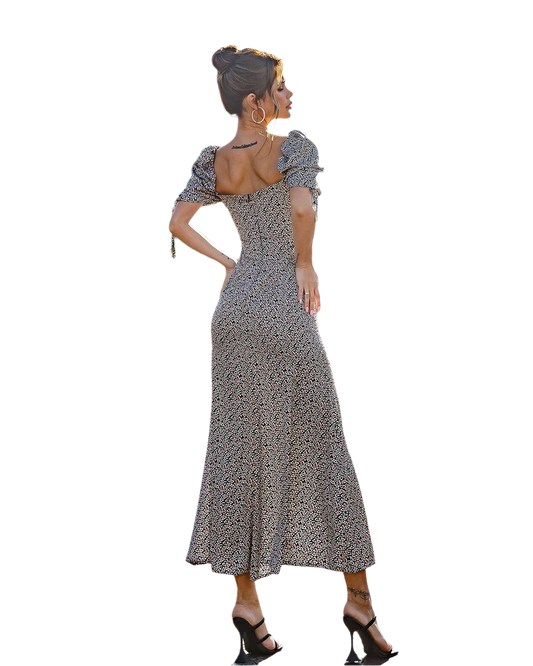 Woman wearing a patterned dress on a white background