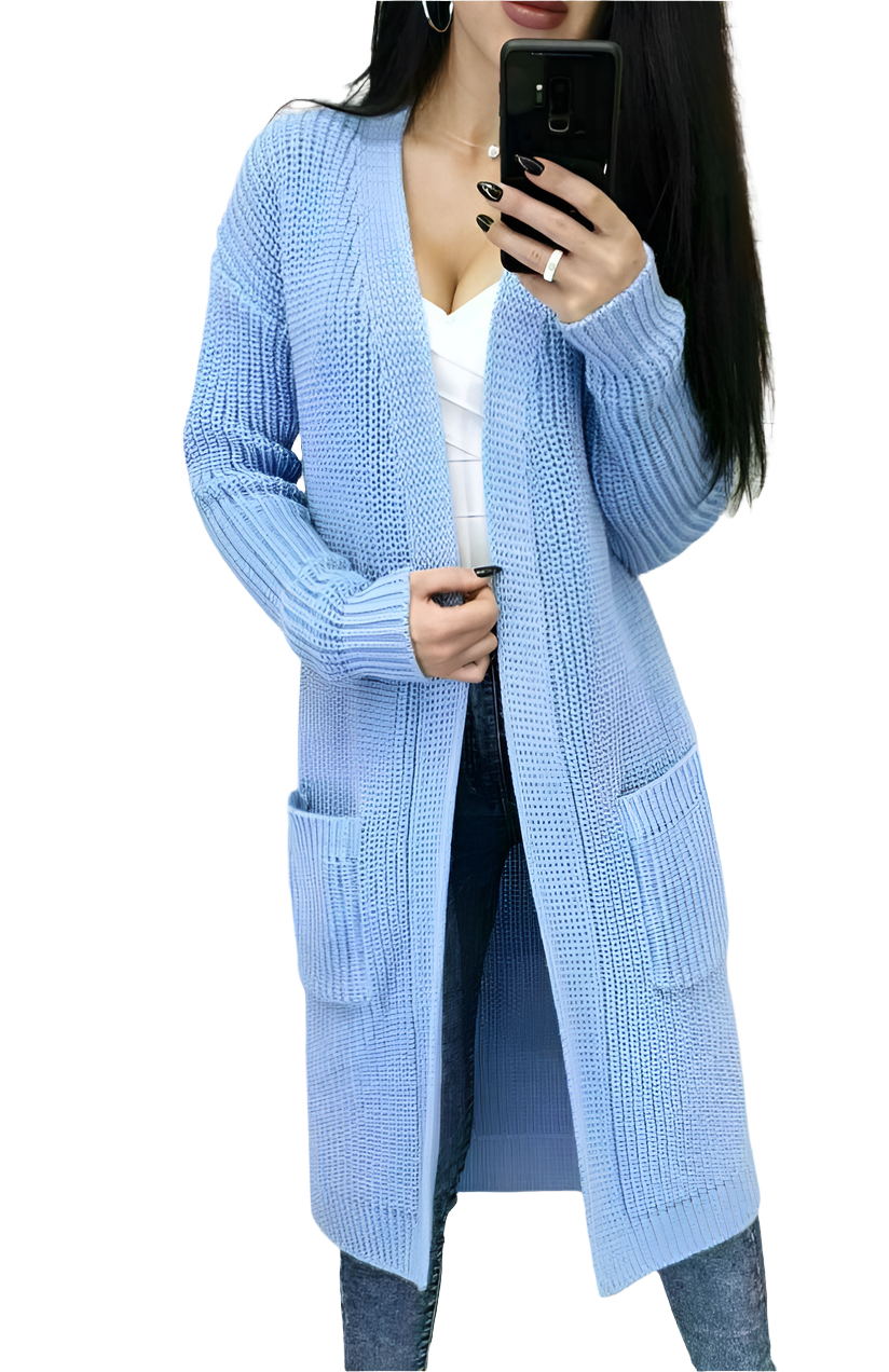 Person wearing a light blue cardigan with pockets on a white background