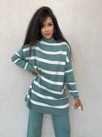 Woman wearing a green and white striped outfit against a light gray background
