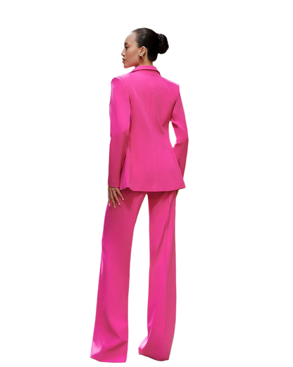 Person wearing a bright pink suit on a white background