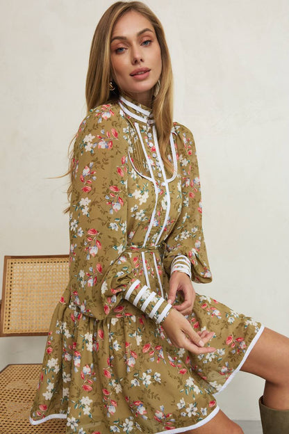 Woman wearing a floral dress with a white background