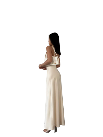 Woman wearing a beige dress on a white background