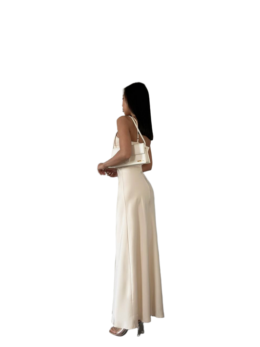 Woman wearing a beige dress on a white background