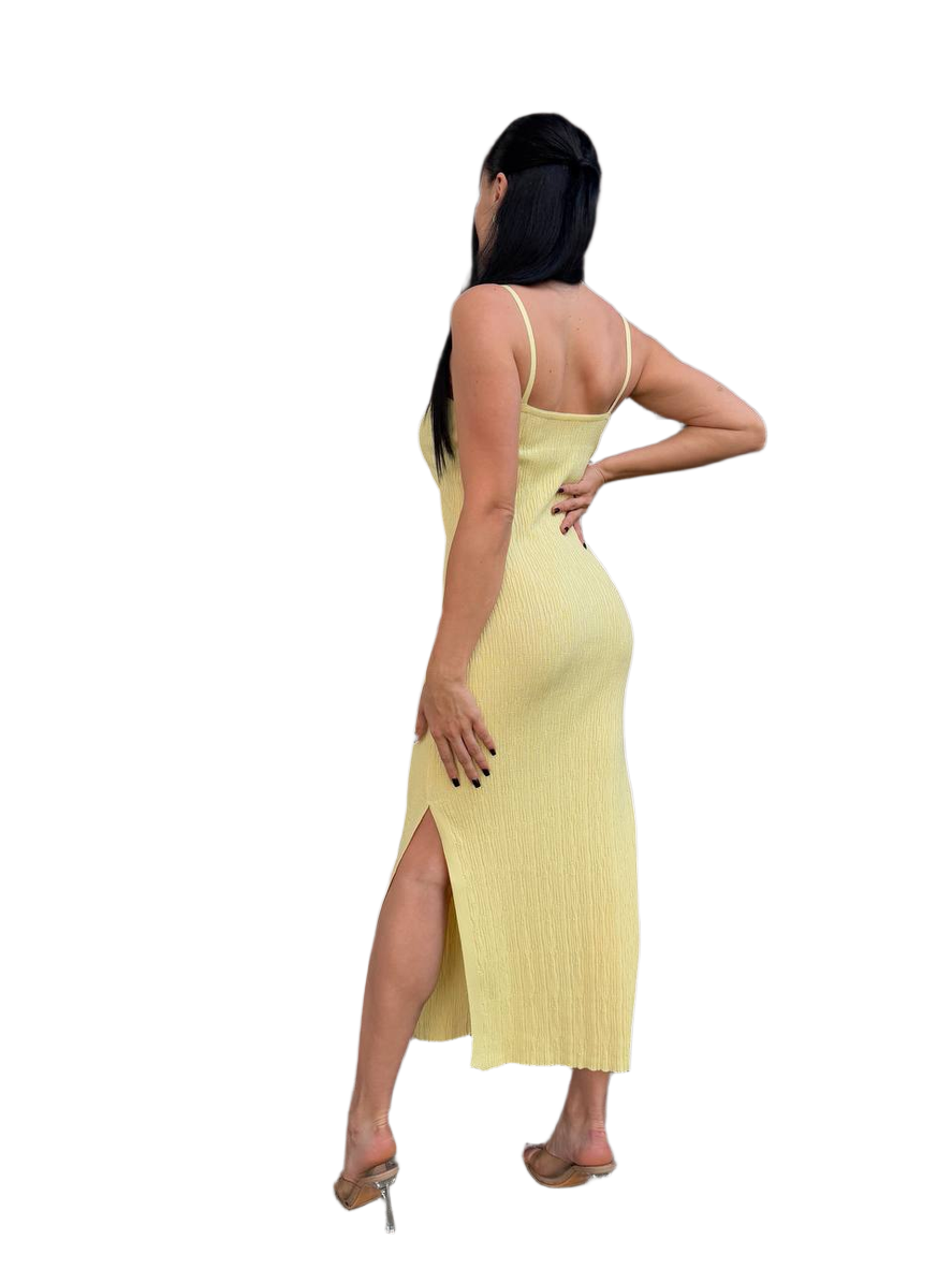 Woman wearing a yellow dress with a white background