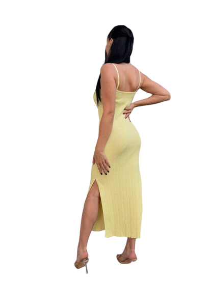 Woman wearing a yellow dress with a white background