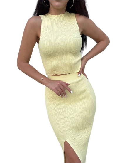 Light yellow ribbed dress with a slit on a white background
