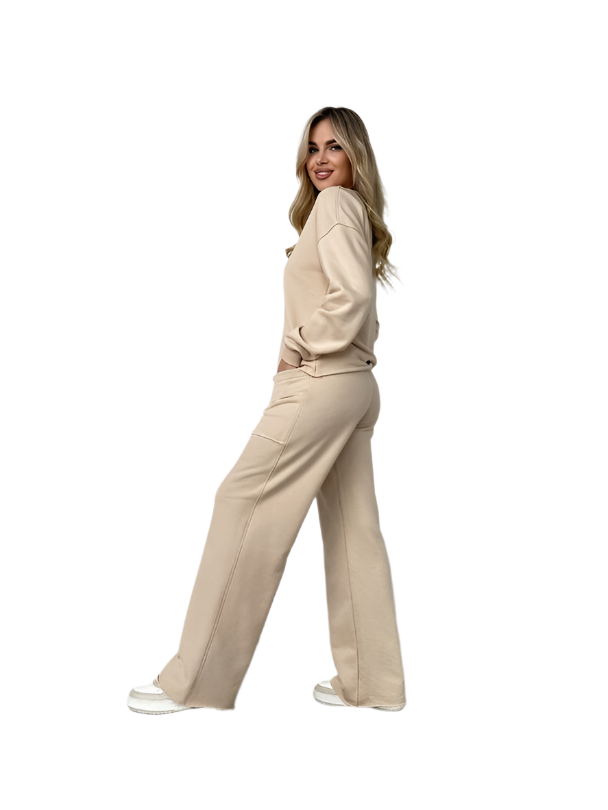 Woman wearing a beige suit on a white background