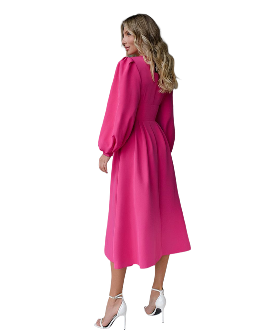 Woman wearing a bright pink dress on a white background