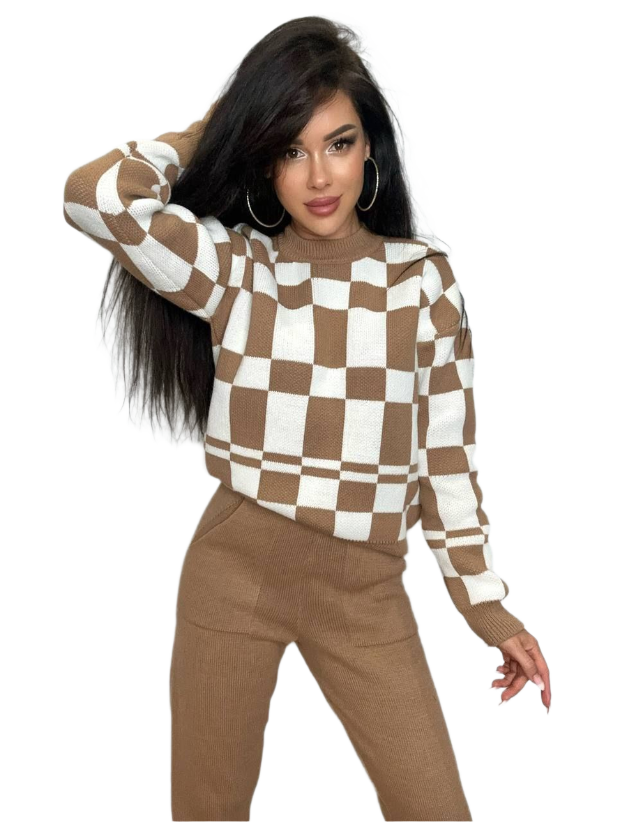 Woman wearing a brown and white checkered sweater with matching pants on a white background
