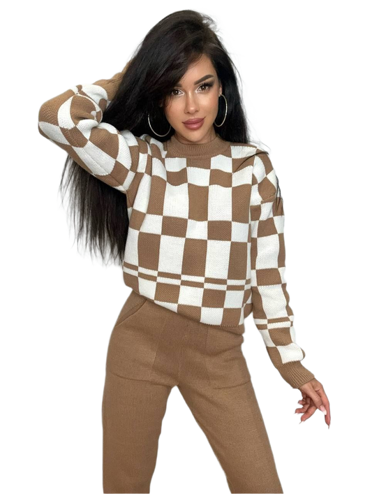 Woman wearing a brown and white checkered sweater with matching pants on a white background