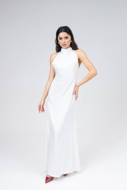 Woman wearing a white sleeveless dress on a white background