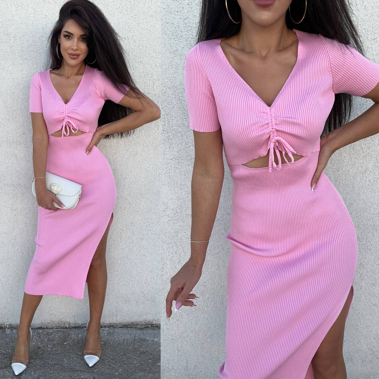 Woman wearing a pink dress with a cutout design, standing against a plain background.