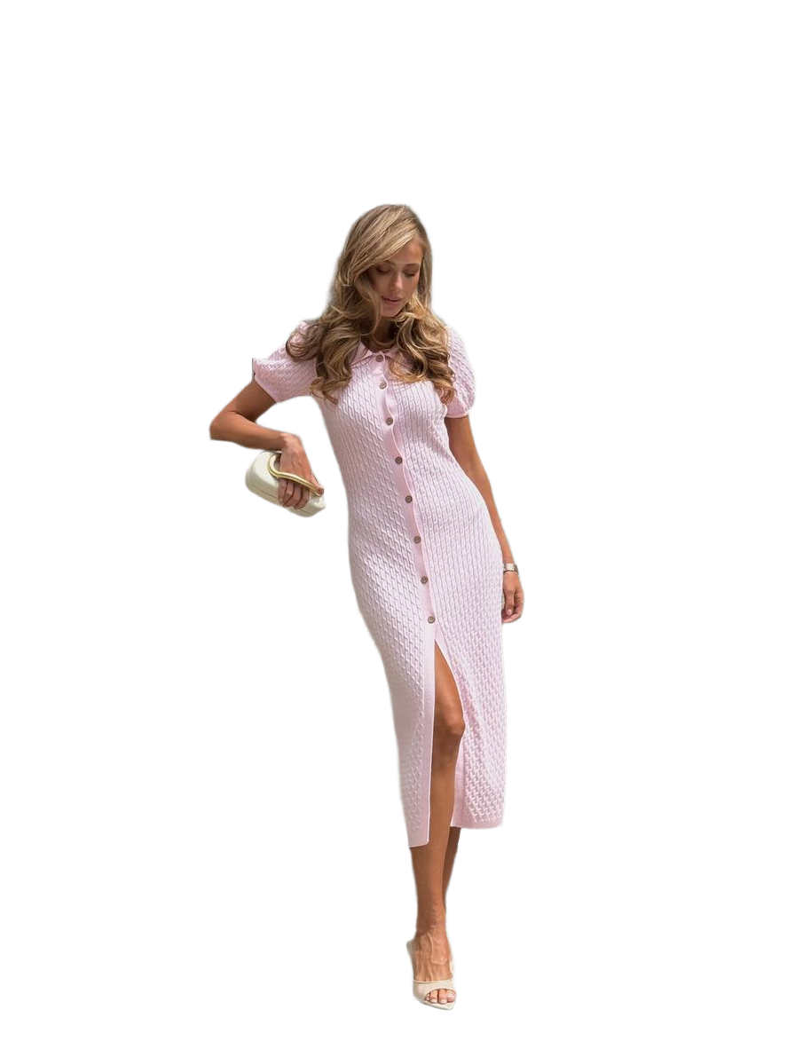 Woman wearing a pink patterned dress on a white background