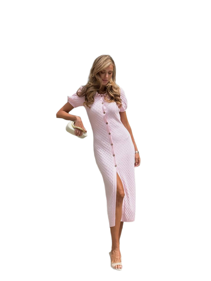 Woman wearing a pink patterned dress on a white background