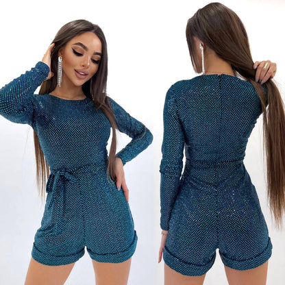 Woman wearing a blue textured romper with front and back views on a white background
