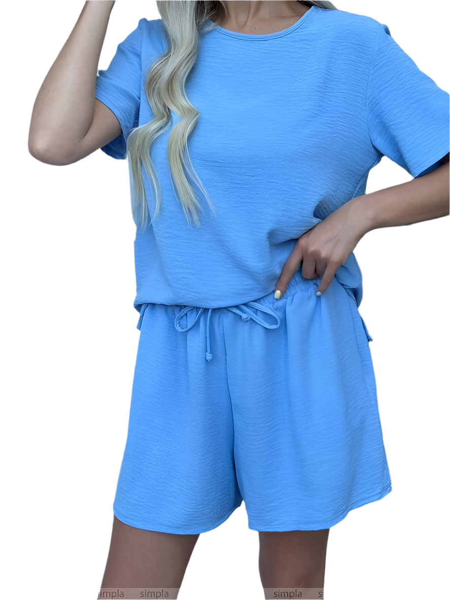 Blue outfit with a top and shorts on a white background