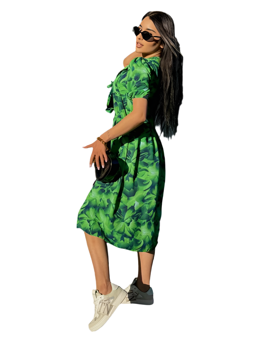 Woman wearing a green floral dress on a white background
