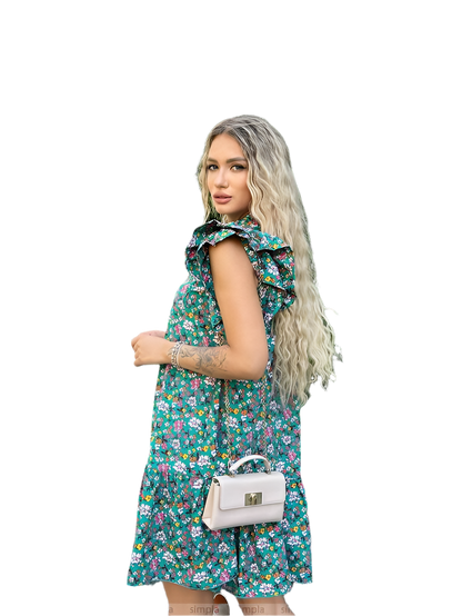 Woman wearing a floral dress holding a white handbag on a white background
