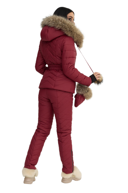 Person wearing a red winter outfit with fur trim on a white background