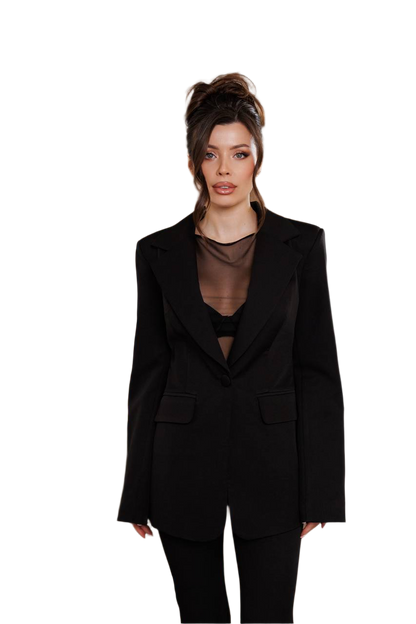Woman wearing a black suit with sheer top on a white background