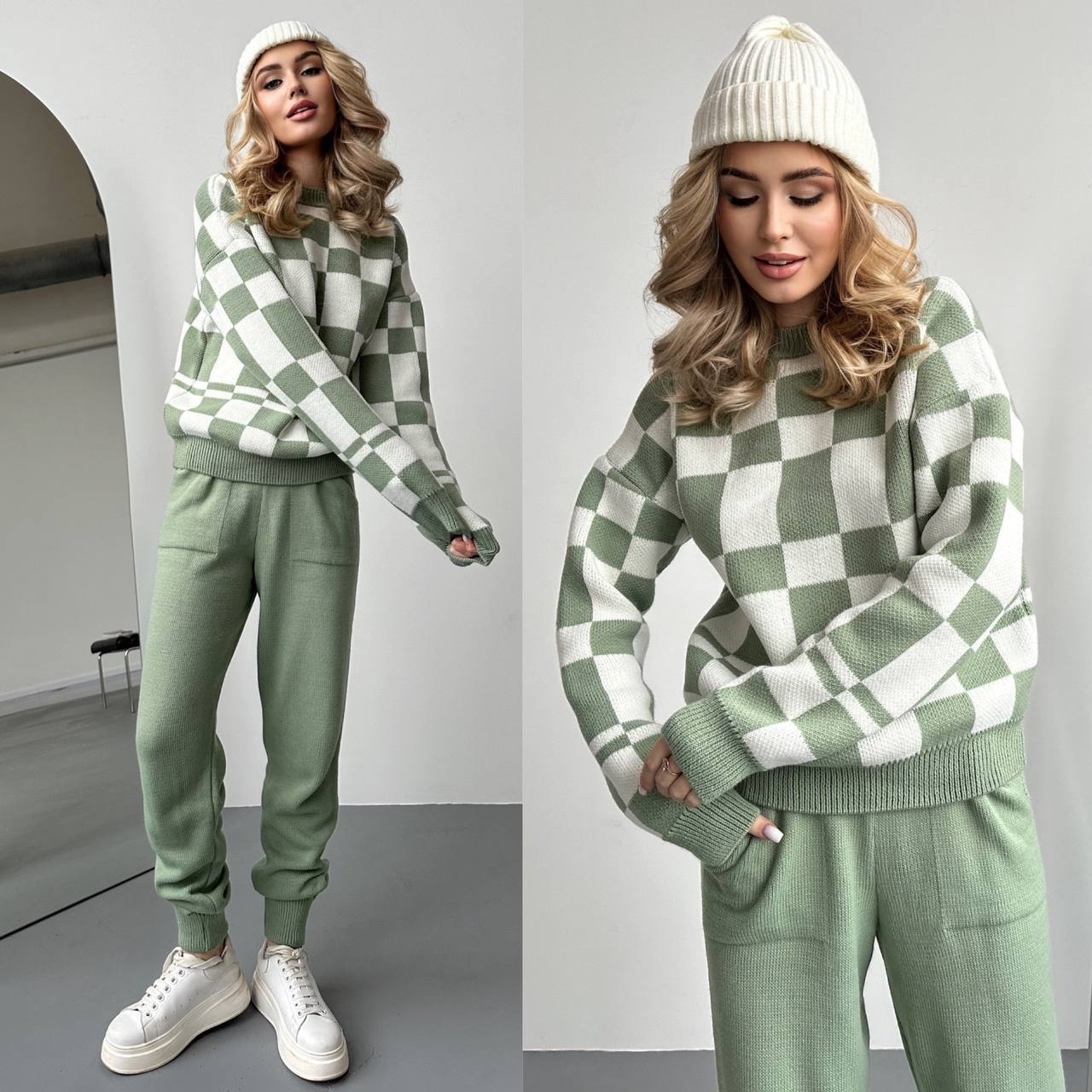 Woman wearing a green and white checkered sweater and pants set with a white beanie.