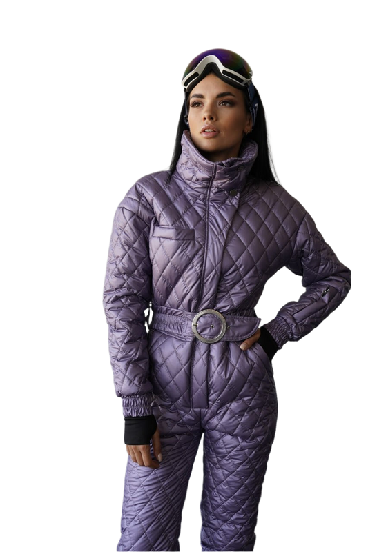 Person wearing a purple quilted snowsuit with goggles on a white background