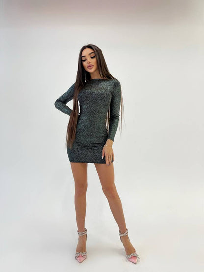 Woman wearing a dark green dress on a white background
