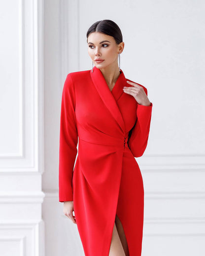 Woman wearing a red dress against a white wall