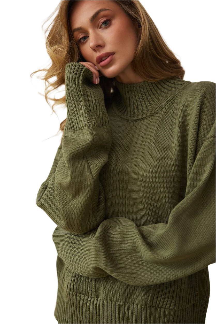 Woman wearing a green sweater against a white background