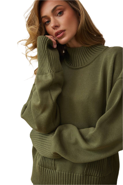 Woman wearing a green sweater against a white background