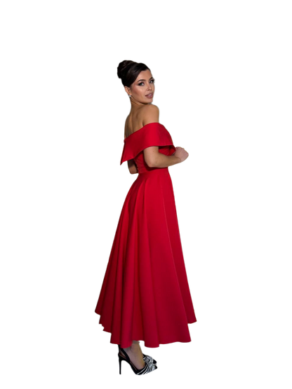 Woman wearing a red off-shoulder gown on a white background
