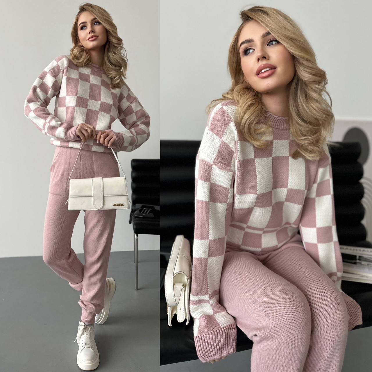 Woman wearing a pink and white checkered sweater and pants sitting on a chair.
