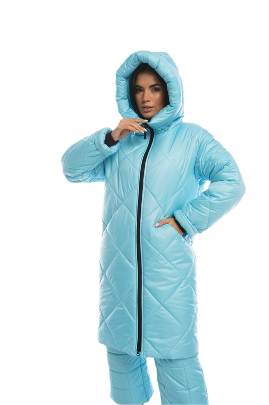 Person wearing a light blue quilted jacket and pants on a white background