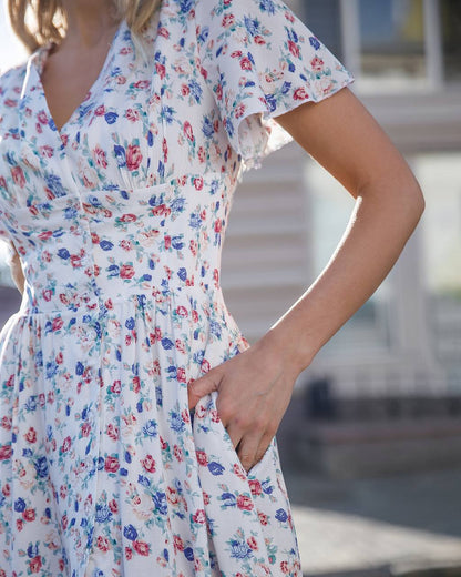 Woman wearing a floral dress with a blurred background