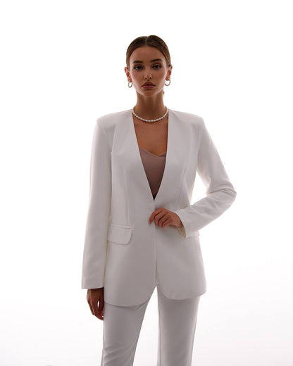 Woman wearing a white suit on a white background