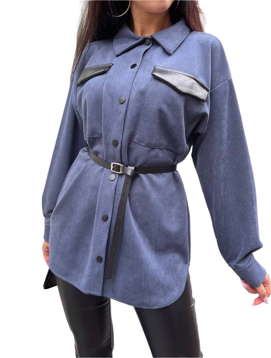 Blue shirt with black accents worn by a person on a white background