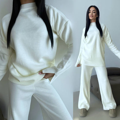 Woman wearing a white outfit with a plain background