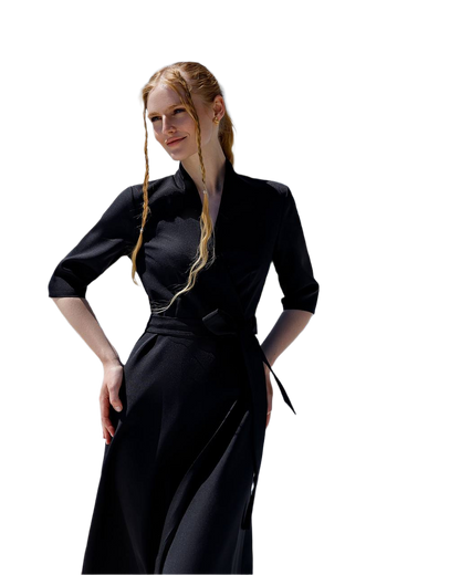 Woman wearing a black dress with a white background