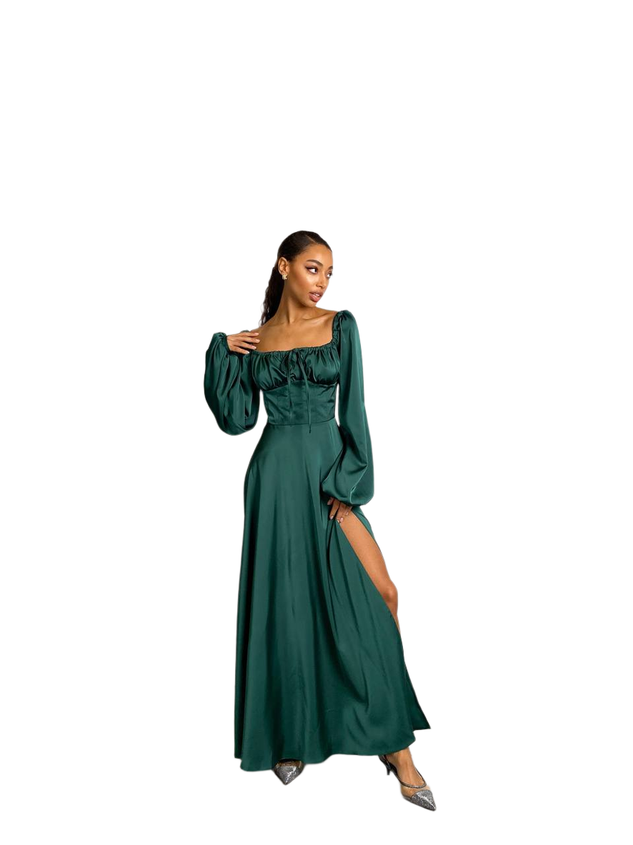 Woman wearing a green dress with long sleeves on a white background