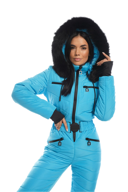 Woman wearing a blue snowsuit with black fur hood on a white background